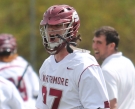 Midfielder Braeden DeWan ’16 (center) celebrates the team’s 7-5 win over Dickinson College April 23.